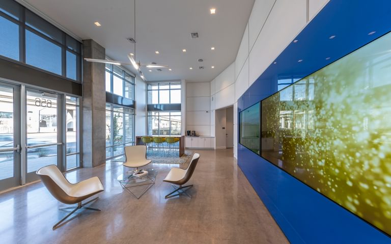Capitol 650 lobby with chairs leasing wall